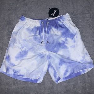 Swim trunks. Purple and white tie dye.